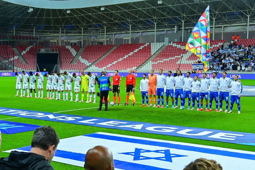 Players of Israel, right, and Ireland stand for the anthems before the UEFA Nations League soccer match between Ireland and Israel in Debrecen, Hungary, Sunday, Sept. 27, 2026. (Zsolt Czegledi/MTI via ...