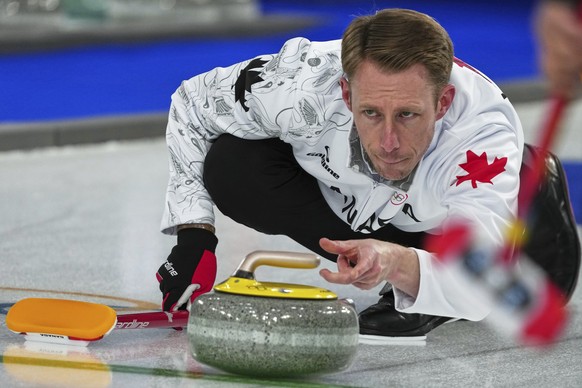 Canada's Marc Kennedy in action during the men's curling round robin session against China, at the 2026 Winter Olympics, in Cortina d'Ampezzo, Italy, Sunday, Feb. 15, 2026. (AP Photo/Mi ...
