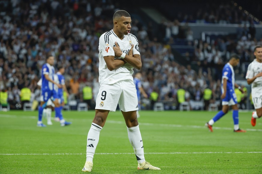 epa11622907 Real Madrid&#039;s Kylian Mbappe celebrates after scoring the 2-0 goal during the Spanish LaLiga soccer match between Real Madrid and Deportivo Alaves, in Madrid, Spain, 24 September 2024. ...