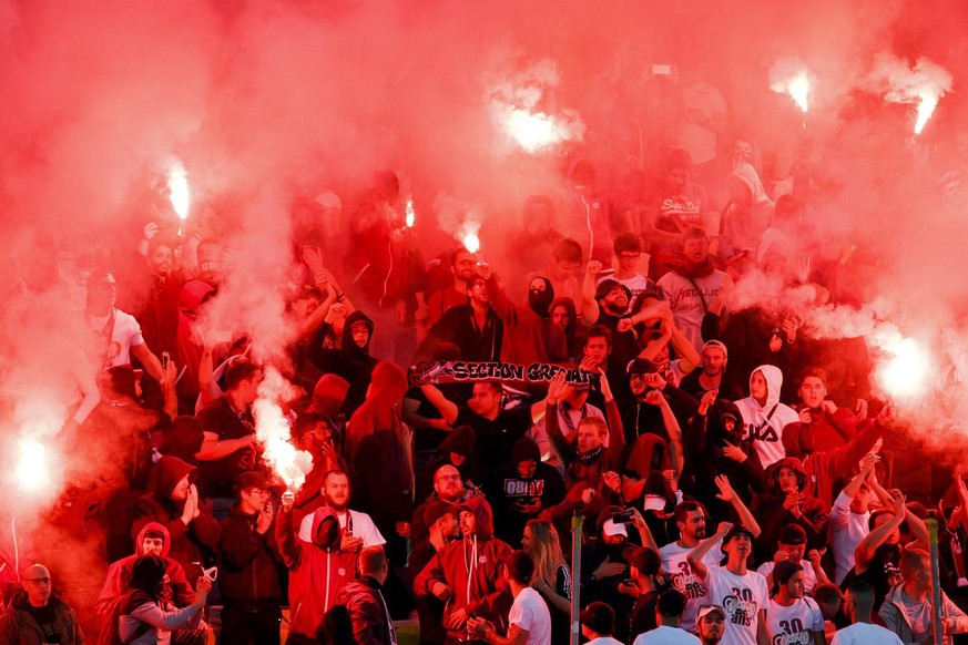 Servette's supporters light smoke flares, during the Challenge League soccer match of Swiss Championship between Servette FC and FC Lausanne-Sport, at the Stade de Geneve stadium, in Geneva, Switzerla ...