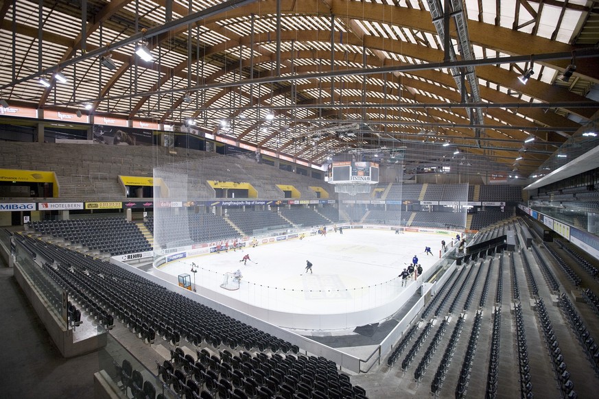 View of the stadium seats in sector G (front and right) and the steep standing place ramp (top left) in the PostFinance-Arena ice hockey stadium in Berne, Switzerland, pictured on February 18, 2009. T ...