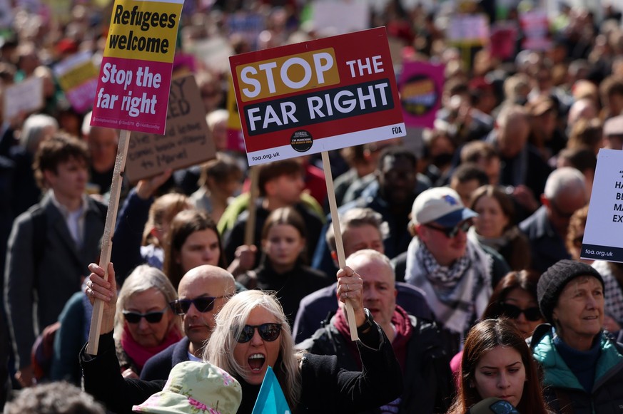 epa12856911 Protesters demonstrate during the 'Together Against the Far Right' protest in London, Britain, 28 March 2026. Tens of thousands of people marched through central London against t ...