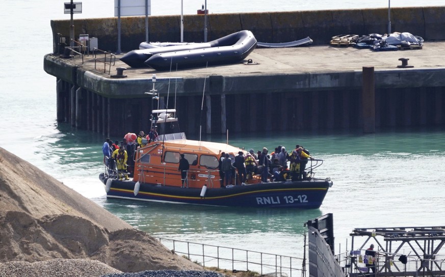 A group of people thought to be migrants are brought in to Dover, Kent, onboard the RNLI Dungeness Lifeboat following a small boat incident in the Channel, Tuesday Sept. 3, 2024. (Gareth Fuller/PA via ...