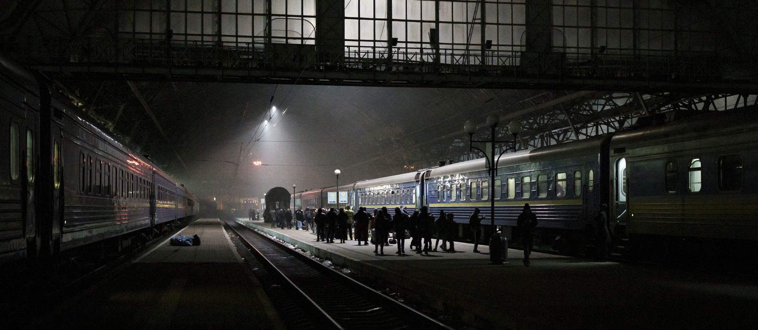 People trying to flee Ukraine wait for trains inside Lviv railway station in Lviv, western Ukraine, Friday, March 4, 2022. (AP Photo/Felipe Dana)