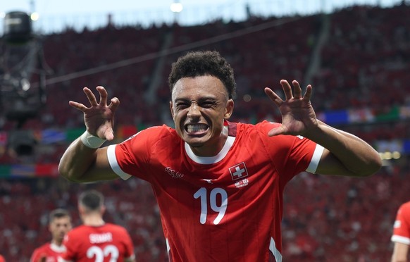epa11432957 Dan Ndoye of Switzerland poses after scoring the 1-0 opening goal during the UEFA EURO 2024 group A soccer match between Switzerland and Germany, in Frankfurt am Main, Germany, 23 June 202 ...