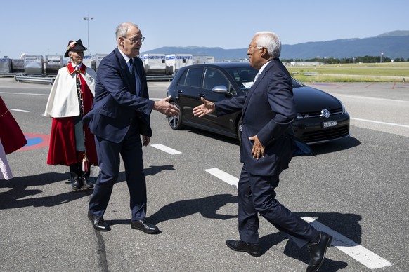 Swiss Federal President Guy Parmelin, left, welcomes European Council President Antonio Costa, right, prior to a trilateral meeting on the sideline of the the Evian G7 summit in Geneva Airport, Switze ...