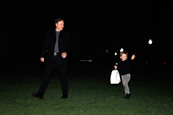 White House Senior Advisor, Tesla and SpaceX CEO Elon Musk and his son X Æ A-12 walk towards the White House after landing on the South Lawn in Marine One with President Donald Trump on April 13, 2025 ...