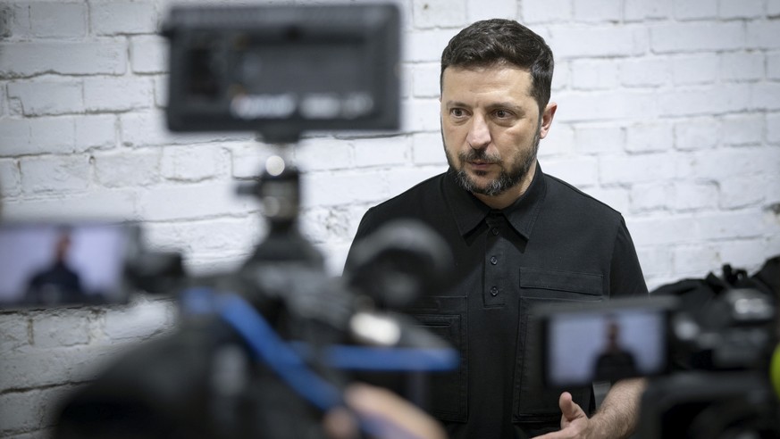 epa12261862 A handout picture made available by the Presidential Press Service shows Ukraine?s President Volodymyr Zelensky visiting a facility where interceptor drones are produced at an undisclosed  ...
