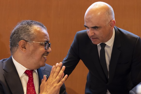 epa09965690 Director-General of the World Health Organization (WHO) Tedros Adhanom Ghebreyesus (L) talks with Swiss Interior Minister Alain Berset (R) during the 75th World Health Assembly at the Euro ...