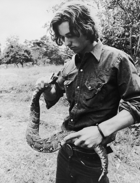 23rd July 1974: Robert Kennedy Jnr holding a puff adder during filming for a television series in Kenya about African wildlife entitled &#039;The Last Frontier&#039;. (Photo by Mohamed Amin/Camerapix/ ...