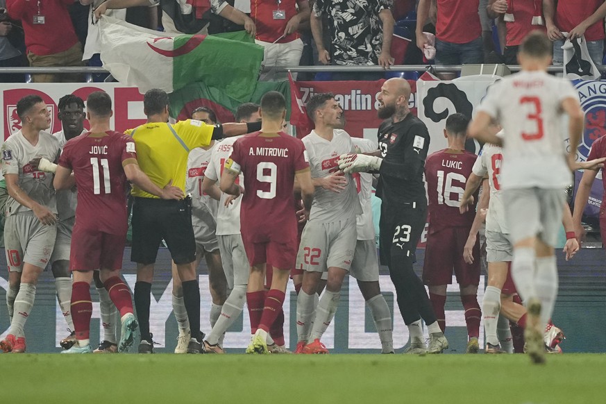 Serbia&#039;s and Swirzerland&#039;s players argue during the World Cup group G soccer match between Serbia and Switzerland, at the Stadium 974 in Doha, Qatar, Friday, Dec. 2, 2022. (AP Photo/Martin M ...