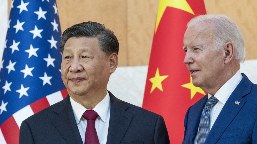 FILE - U.S. President Joe Biden, right, stands with Chinese President Xi Jinping before a meeting on the sidelines of the G20 summit meeting on Nov. 14, 2022, in Bali, Indonesia. Xi accused Washington ...