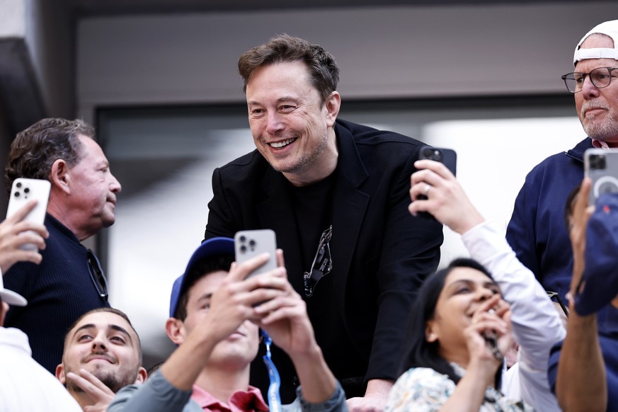 epa11593859 Businessman Elon Reeve Musk (C) attends the men&#039;s final match of the US Open Tennis Championships between Jannik Sinner of Italy and Taylor Fritz of the United States, at the USTA Bil ...