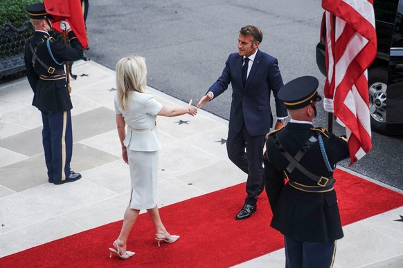 U.S. Chief of Protocol Monica Crowley greets French President Emmanuel Macron as he arrives at the White House amid negotiations to end the Russian war in Ukraine, in Washington, D.C., U.S., August 18 ...