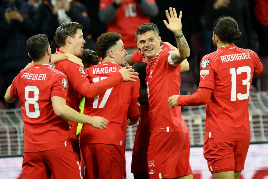 Switzerland&#039;s players with Switzerland&#039;s midfielder Granit Xhaka, center, celebrate the second goal during the UEFA Euro 2024 qualifying group I soccer match between Switzerland and Israel,  ...