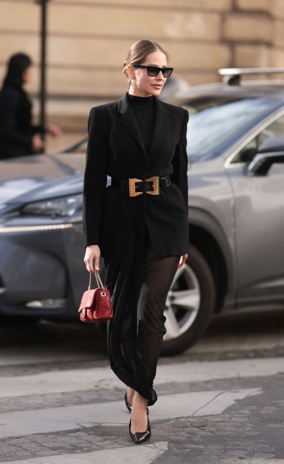 BERLIN, GERMANY - DECEMBER 10: Sonia Lyson is seen wearing black, oval-shaped Vehla sunglasses. Her outfit is cream-colored, consisting of a long, oversized faux fur coat that reaches her ankles. Unde ...