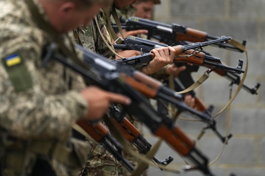 Ukrainian volunteer military recruits take part in an urban battle exercise whilst being trained by British Armed Forces at a military base in Southern England, Monday, Aug. 15, 2022. MOD and British  ...