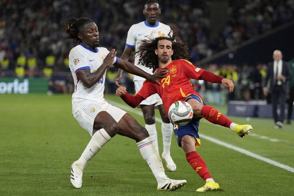 France&#039;s Manu Kone, left, and Spain&#039;s Marc Cucurella fight for the ball during the Nations League semifinal soccer match between Spain and France in Stuttgart, Germany, Thursday, June 5, 202 ...