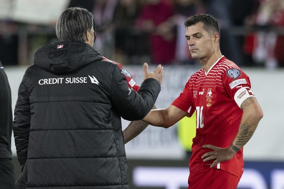 Switzerland&#039;s head coach Murat Yakin, and midfielder Granit Xhaka, from left left, react during the UEFA Euro 2024 qualifying group I soccer match between Switzerland and Belarus, on Sunday, Octo ...