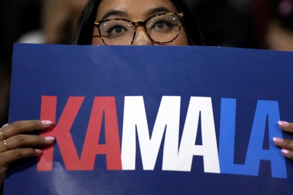 A supporter listens as Democratic presidential nominee Vice President Kamala Harris speaks at a campaign rally at the University of Nevada, Las Vegas on Saturday, Aug. 10, 2024. (AP Photo/Jae Hong)
