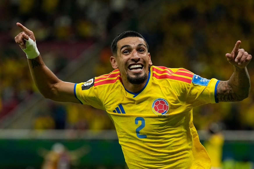 Colombia's Daniel Munoz celebrates after scoring his side's opening goal during the World Cup Group K soccer match between Colombia and Congo in Zapopan, near Guadalajara, Mexico, Tuesday, J ...