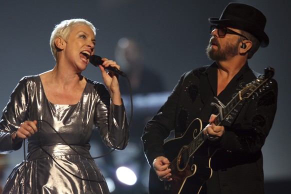 FILE - Annie Lennox, left, and Dave Stewart of the Eurythmics performing at The Night that Changed America: A Grammy Salute to the Beatles in Los Angeles on Jan. 27, 2014. Lennox and Stewart will be i ...