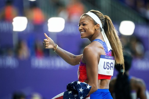 PARIS, FRANCE: AUGUST 09: Gabrielle Thomas of the United States celebrates the team gold medal victory in the Women&#039;s 4 x 100m Relay Final during the Athletics Competition at the Stade de France  ...