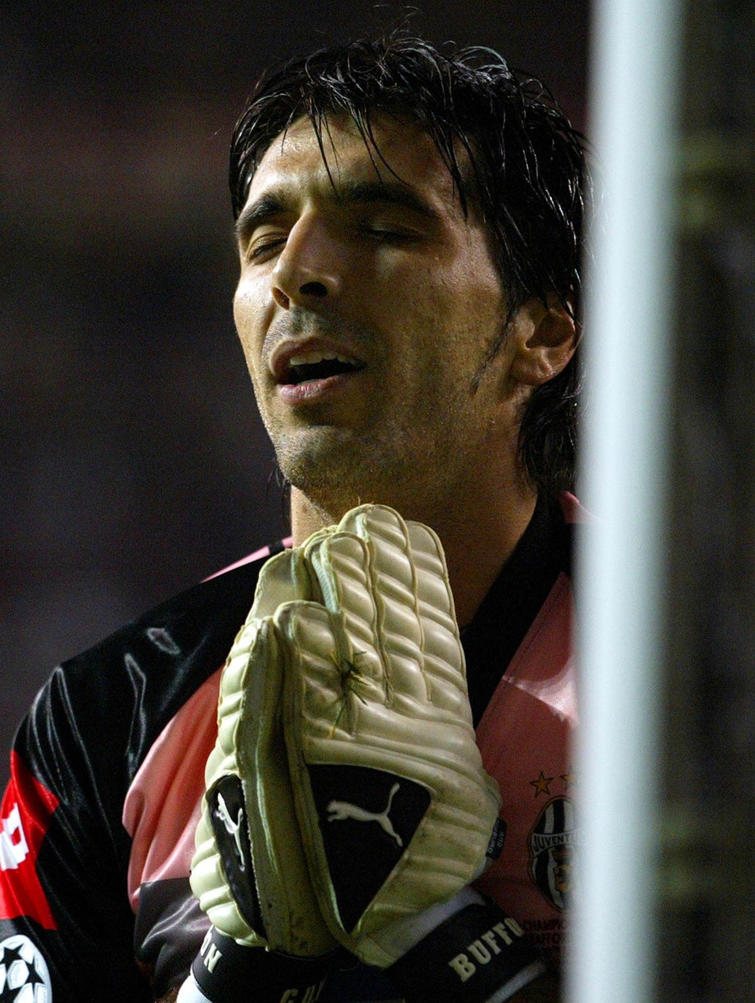 Juventus goalkeeper Gianluigi Buffon prays during a penalty shootout during the UEFA Champions League final between Juventus and AC Milan at Old Trafford, Manchester, England Wednesday May 28, 2003. M ...