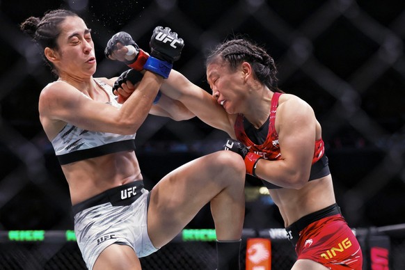 Brazil&#039;s Bruna Brasil (L) fights against China&#039;s Shi Ming during their women&#039;s Strawweight event of the UFC Fight Night in Shanghai on August 22, 2025. (Photo by -STR / AFP) / China OUT ...