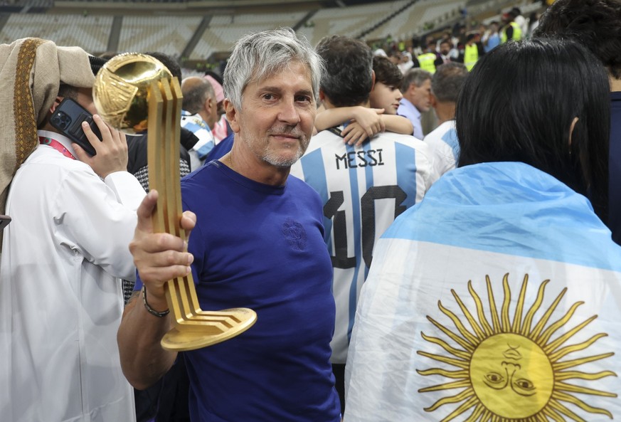 LUSAIL CITY, QATAR - DECEMBER 18: Jorge Messi, father and agent of Lionel Messi - holding his son's trophy of 'Best player of the World Cup - following the FIFA World Cup Qatar 2022 Final ma ...