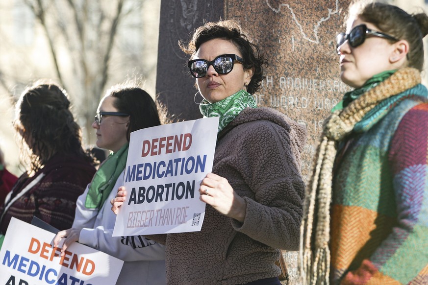 Lindsay London holds protest sign in front of federal court building in support of access to abortion medication outside the Federal Courthouse on Wednesday, March 15, 2023 in Amarillo, Texas. A conse ...