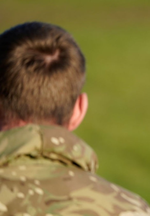 SALISBURY, ENGLAND - NOVEMBER 23: Prince William, Prince of Wales, Colonel-in-Chief, 1st Battalion Mercian Regiment (L) listens to a briefing ahead of an attack exercise during a visit to the regiment ...