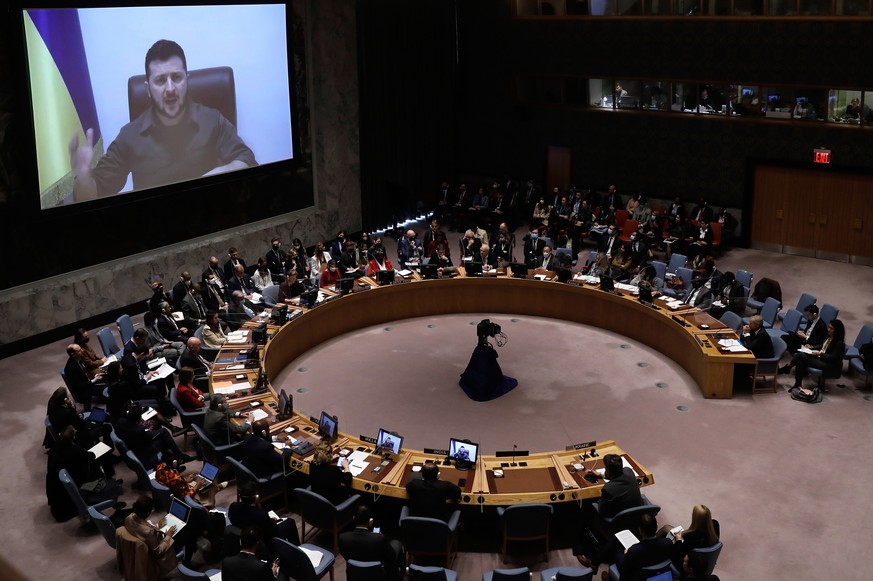 epa09871943 President Volodymyr Zelensky of Ukraine appears on screen and speaks during a United Nations Security Council meeting on the situation in Ukraine amid the Russian military invasion, at the ...