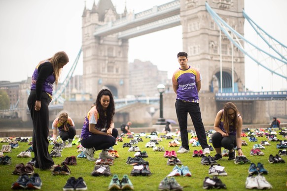 Marathon runners look at shoes during the unveiling of Pancreatic Cancer UK&#039;s installation Shoes of Hope at Potter&#039;s Fields Park in London. Picture date: Tuesday April 15, 2025. (Photo by Ja ...
