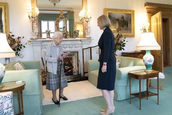Britain&#039;s Queen Elizabeth II, left, welcomes Liz Truss during an audience at Balmoral, Scotland, where she invited the newly elected leader of the Conservative party to become Prime Minister and  ...