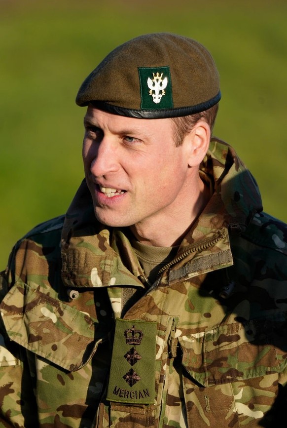 SALISBURY, ENGLAND - NOVEMBER 23: Prince William, Prince of Wales, Colonel-in-Chief, 1st Battalion Mercian Regiment (L) listens to a briefing ahead of an attack exercise during a visit to the regiment ...