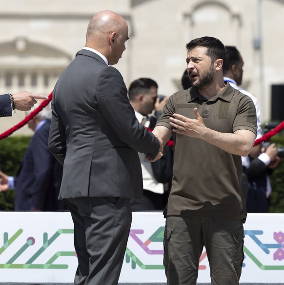 epa10666596 Ukrainian President Volodymyr Zelensky (R) and Swiss Federal President Alain Berset (L), speak after the family photo at the European Political Community (EPC) Summit at the Mimi Castle in ...