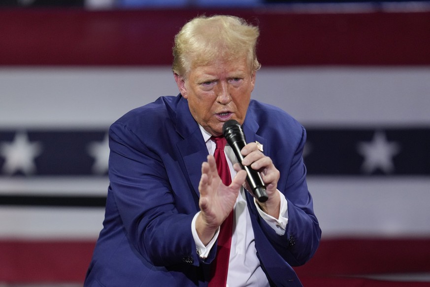Republican presidential candidate former President Donald Trump speaks during a town hall event at the Dort Financial Center in Flint, Mich., Tuesday, Sept. 17, 2024. (AP Photo/Paul Sancya)
Donald Tru ...