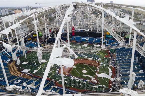 The roof of the Tropicana Field is damaged the morning after Hurricane Milton hit the region, Thursday, Oct. 10, 2024, in St. Petersburg, Fla. (AP Photo/Julio Cortez)