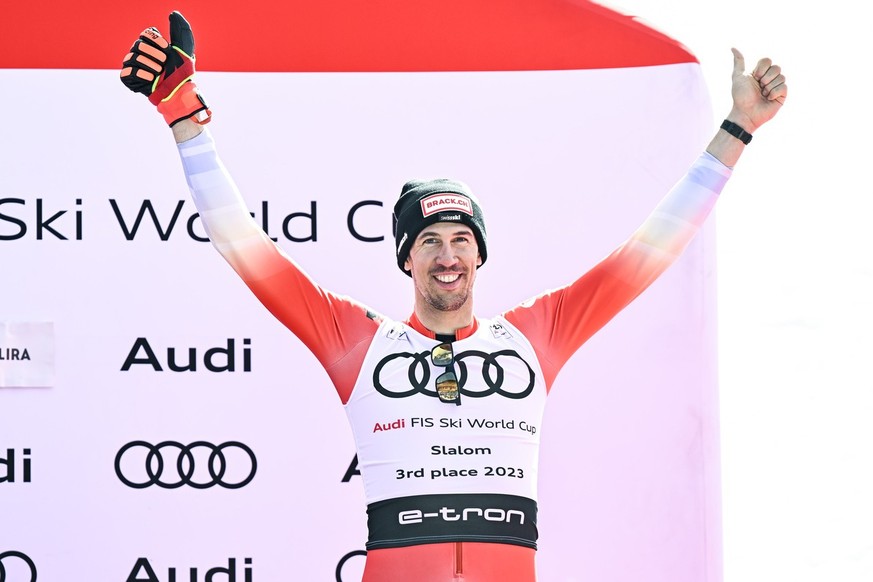 Third placed of the men&#039;s slalom overall classification Ramon Zenhaeusern of Switzerland, celebrates during the podium ceremony at the FIS Alpine Skiing World Cup finals in Soldeu, Andorra, Sunda ...