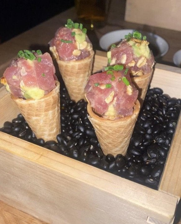 we want plates
Raw fish with peanuts served in ice cream cones served in a box filled with beans

https://www.reddit.com/r/WeWantPlates/comments/s5tnln/raw_fish_with_peanuts_served_in_ice_cream_cones/