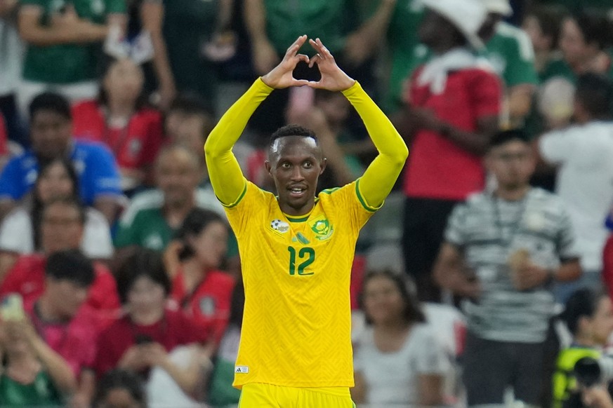 South Africa's Thapelo Maseko (12) celebrates after scoring his side's opening goal during the World Cup Group A soccer match between South Africa and South Korea in Guadalupe, near Monterre ...