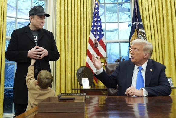 President Donald Trump speaks as Elon Musk, joined by his son X � A-Xii, listens in the Oval Office at the White House, Tuesday, Feb. 11, 2025, in Washington. (Photo/Alex Brandon)