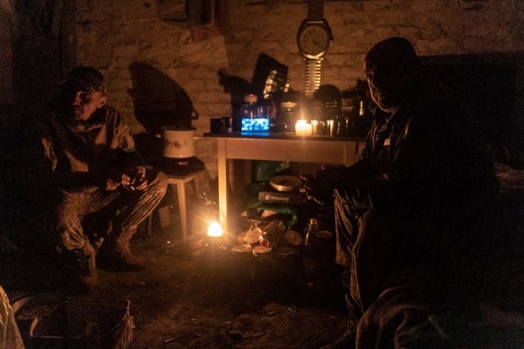 DONETSK OBLAST, UKRAINE - APRIL 22: Ukrainian soldiers of the 24th Separate Assault Battalion named Aidar, also known as the Aidar Battalion, take a rest in a cellar near the frontline in the directio ...