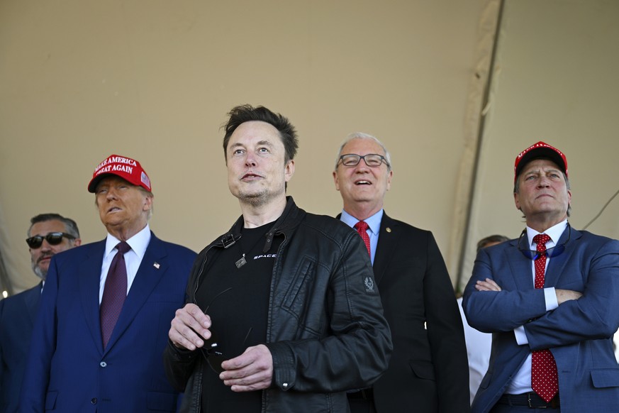 President-elect Donald Trump watches with Elon Musk as Sen. Bill Hagerty, R-Tenn., left, and Sen. Ted Cruz, R-Texas, left, Sen. Kevin Cramer, R-N.D., and Rep. Ronny Jackson, R-Texas, before the launch ...