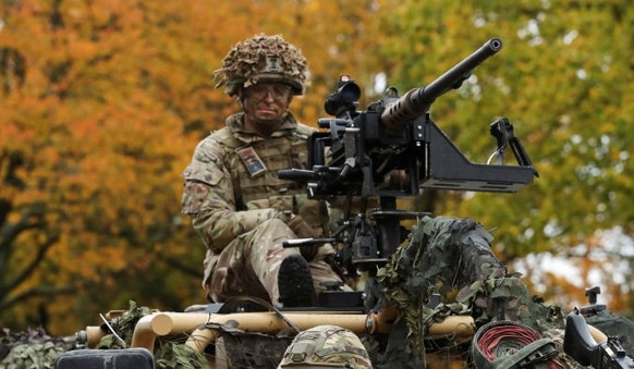 DEREHAM, ENGLAND - NOVEMBER 8: Catherine, Princess of Wales drives an armoured vehicle as she visits The Queen's Dragoon Guards Regiment for the first time as their Colonel in Chief on November 8 ...