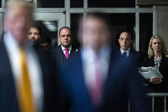 New York, NY - May 29 : Boris Epshteyn, attorney Emil Bove, and Natalie Harp listen as former President Donald Trump speaks to reporters as jurors are released to begin deliberations for his criminal  ...