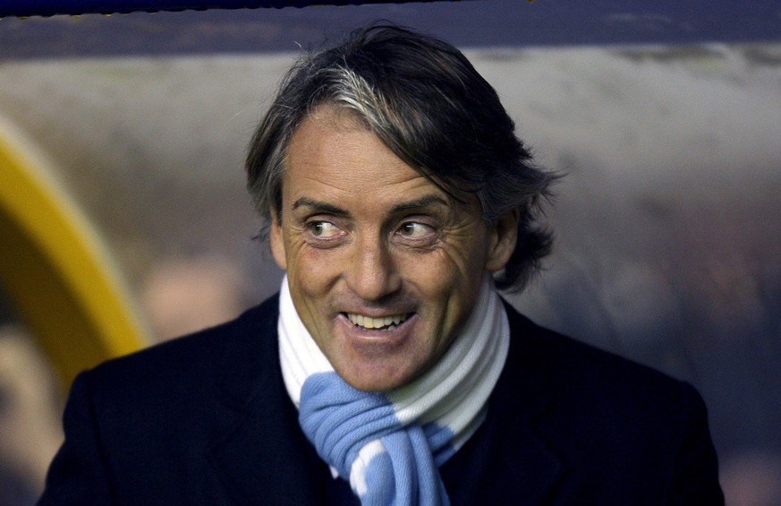 Manchester City's Roberto Mancini, looks on before his teams English Premier League soccer match against Wolverhampton Wanderers at the Molineux stadium, Wolverhampton, England. Monday Dec. 28, 2 ...