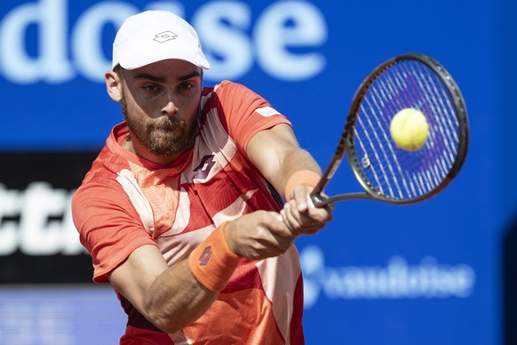 Benjamin Bonzi of France in action against Daniel Altmaier of Germany at the Swiss Open tennis tournament in Gstaad, Switzerland, on Monday, July 17, 2023. (KEYSTONE/Peter Schneider)