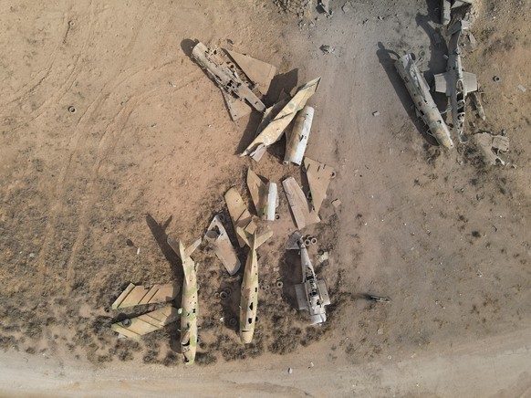 epaselect epa11772291 An aerial picture taken by a drone shows damaged Syrian government war planes in the Mezzeh Military Airport in Damascus, Syria 12 December 2024. The Israeli army stated it has c ...